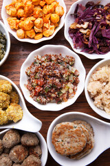 Nutrition concept - Healthy meals in white bowls over wooden background. Healthy food, Diet, Detox, Clean Eating or Vegetarian concept. Top view sets.