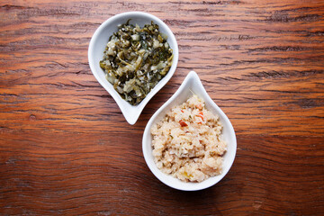 Nutrition concept - Healthy meals in white bowls over wooden background. Healthy food, Diet, Detox, Clean Eating or Vegetarian concept. Top view sets.