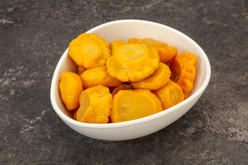 Marinated yellow patisson in the bowl