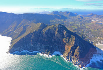 Cape Town, Western Cape / South Africa - 06/07/2019: Aerial photo of Noordhoek and Chapman's Peak, with Cape Flats in the background