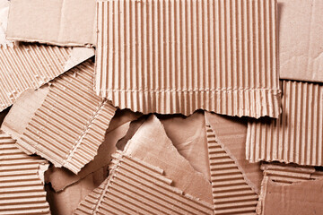 Pieces of cardboard box. The concept of recycling waste paper.