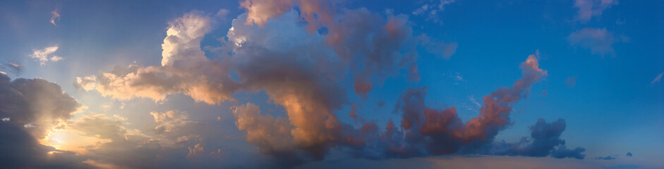 Naklejka na ściany i meble Sunset sky.Air clouds at sunset day.