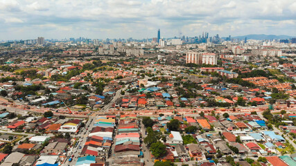 Obraz premium Panorama of all of Kuala Lumpur from the far outskirts of the city. Malaysia. Drone aerial footage.