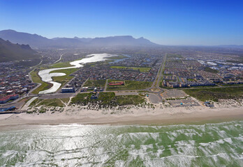 Cape Town, Western Cape / South Africa - 09/05/2019: Aerial photo of a Muizenberg Beach with Table Mountain in the background