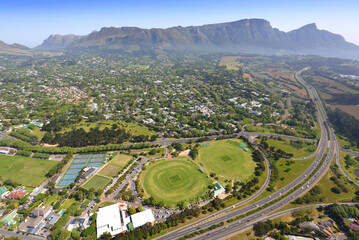 Cape Town, Western Cape / South Africa - 09/27/2019: Aerial photo of Constantia Virgin Active and Claremont Cricket Club with Table Mountain in the background