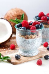  Chia pudding with fresh berries ,chia seed  dessert pudding,with fruits , in white key, Two chia pudding in glass