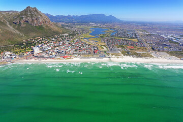 Cape Town, Western Cape / South Africa - 11/22/2019: Aerial photo of Muizenberg Beach with Table Mountain in the background