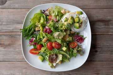 caesar salad fresh vegetable mix avocado with red tomato