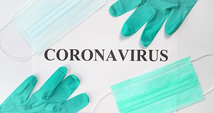 Zooming in Coronavirus word with medical protective masks and gloves 