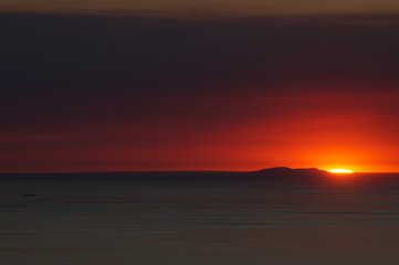 A Vessel Passes In Front of St. Nicolas Island During an Epic Sunset