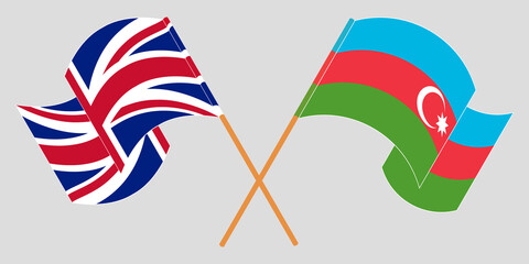 Crossed and waving flags of Azerbaijan and the UK