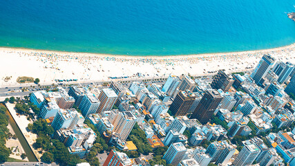 Rio's Best Beaches with turquoise water: famous Copacabana Beach, Ipanema Beach, Barra da Tijuca Beach in Rio de Janeiro, Brazil. Aerial view of Rio de Janeiro from helicopter. Top view, horizontal