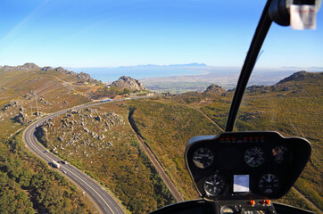 Cape Town, Western Cape / South Africa - 07/24/2017: Pilot's view of Sir Lowry's Pass with Table Mountain and False Bay in the background