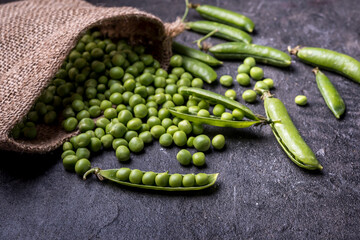 young  green peeled peas on burlap