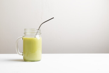 Matcha green tea latte in glass jar