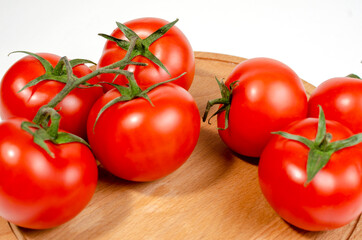 Fresh tomatoes on vintage wooden table
