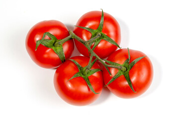 a sprig of red tomatoes is isolated on a white background