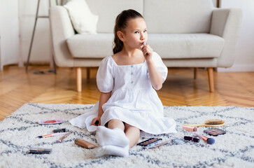 Kid Girl Making Makeup Putting On Lipstick Playing At Home