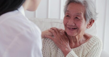 Female doctor visiting senior woman at home. Female doctor help patient at checkup medical consultation at home. elderly grandma listen caregiver giving support. healthcare and medical concept - Powered by Adobe