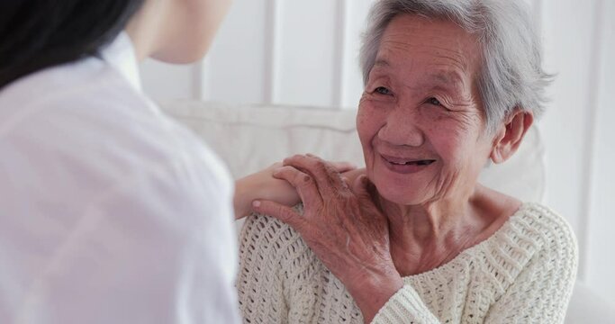 Female Doctor Visiting Senior Woman At Home. Female Doctor Help Patient At Checkup Medical Consultation At Home. Elderly Grandma Listen Caregiver Giving Support. Healthcare And Medical Concept