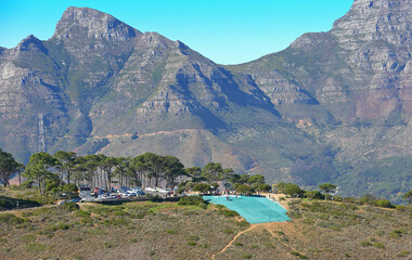 Cape Town, Western Cape / South Africa - 04/30/2018: Aerial photo of Lions Head paragliding launch area with aerial cableway in the background