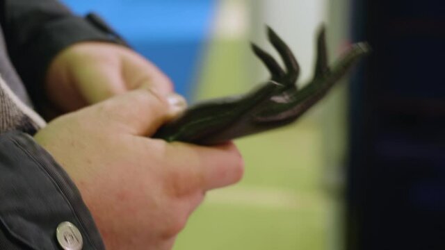 Man demonstrates different plastic things on 3d printer