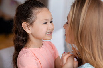 Happy Kid Girl Holding Hands With Mother Indoors