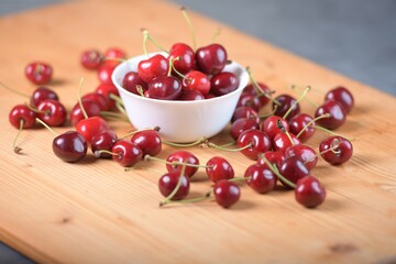 Red Cherries. pile of ripe cherries with stalks.