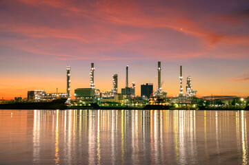 Obraz na płótnie Canvas Oil refinery plant from industry, petrochemical oil and gas refinery and pipeline industry with sunrise sky background.