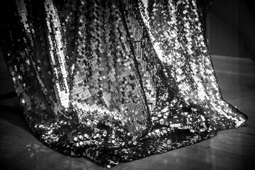 Retro style monochrome photo of long train dress made from fashion glamour sequins fabric