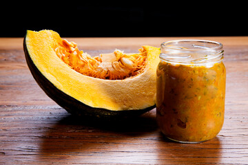 Nutrition concept - Healthy meals in glass jar made of pumpkin over wooden background. Healthy food, Diet, Detox, Clean Eating or Vegetarian concept.