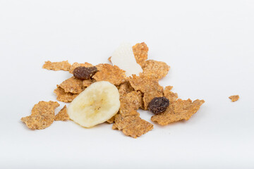 Top View Close up Mixture of granola or muesli on white background, dehydrated fruit mix, healthy food, almond, sun dried cultivated banana, cranberry, cashew nut, pumpkin, melon seed