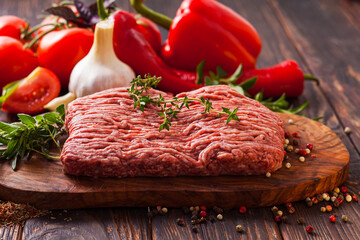 Cooking a italian dish of minced meat and fresh vegetables