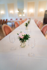 Glasses and flowers on wedding table