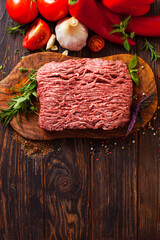 The ground meat with ingredients for cooking italian dish