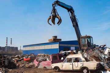 Utilization of the car. Old car at the dump of scrap metal. Utilization of the car at the dump.
