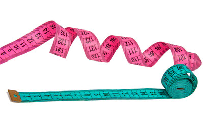 Pink and blue rubber tapes measure for sewing cloth or fabric isolated on the white