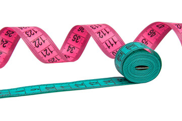 Pink and blue rubber tapes measure for sewing cloth or fabric isolated on the white