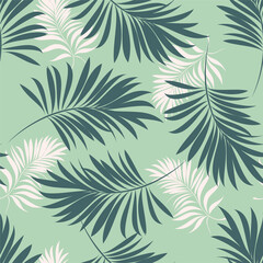 Palm leaves. Tropical seamless background pattern. Graphic design with amazing palm trees suitable for fabrics, packaging, covers