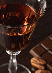 A part of cognac glass with amber-colored cognac.