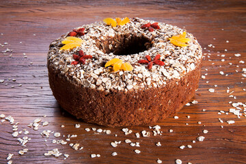 Traditional homemade Christmas cake. Holiday dessert with Damascus and dry goji berry on vintage...