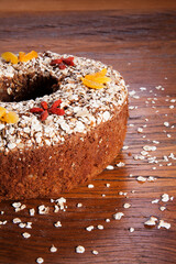 Traditional homemade Christmas cake. Holiday dessert with Damascus and dry goji berry on vintage...