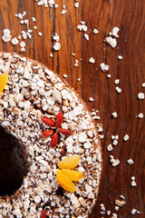 Traditional homemade Christmas cake. Holiday dessert with Damascus and dry goji berry on vintage...