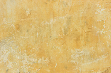 Background yellow old rusty plastered wall