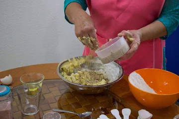 Foto op Canvas Hands of a woman making a cookie mix © Paulina