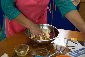 Hands of a woman mixing butter