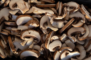 Close-up on cut and raw mushrooms
