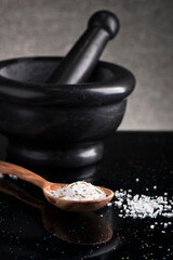 Sea salt in wooden spoon