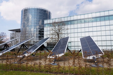 Blue rotating solar panels tilted axis tracker, future innovation energy concept