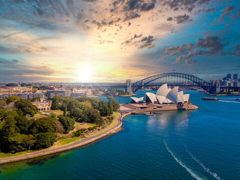 Amazing Aerial Sunset View Of The Sydney From Above With Harbour Bridge And The Bay.